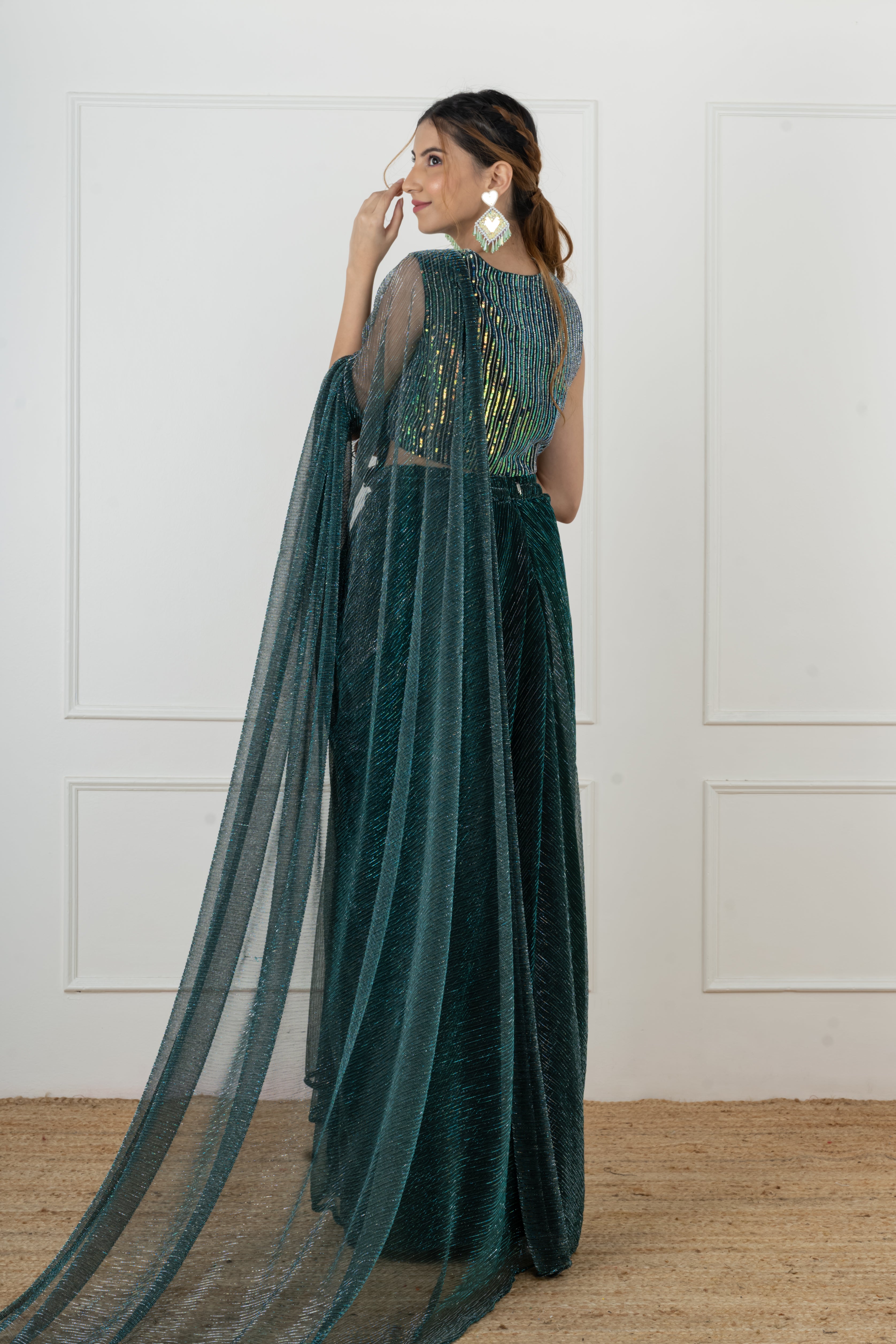 Bottle green draped saree